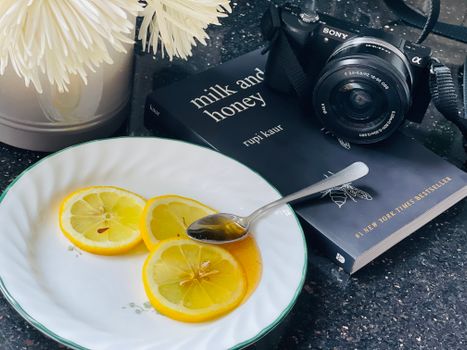 honey and lemon on a spoon